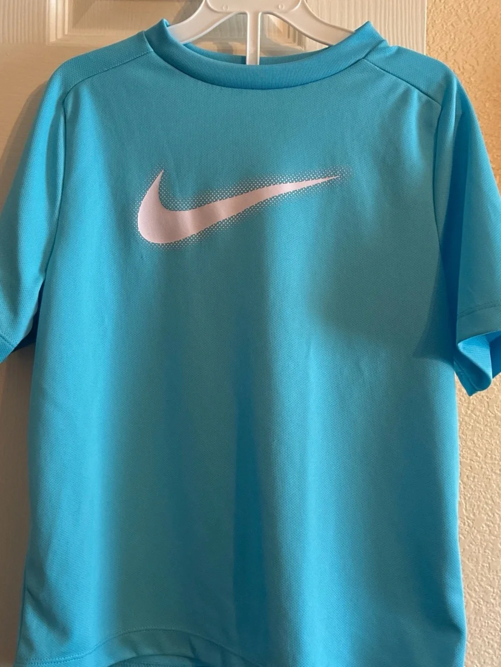Nike Youth Short Sleeve Performance Tee in Aqua Blue with White Swoosh